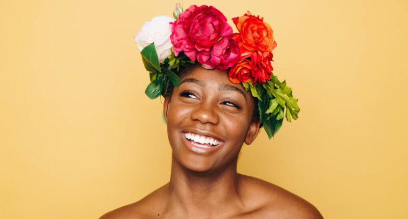 woman smiling wearing flower crown